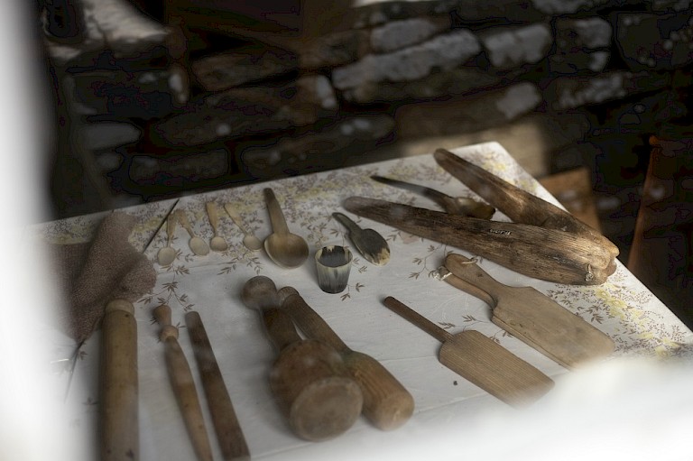 Shappin trees (for mashing tatties); butter pats; spoon mould for shaping horn spoons; horn spoons and cup; rolling pin